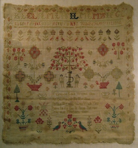 Early 19th century sewing sampler stitched by Elizabeth Lyle when a young girl.  The text in the center reads,"Elizabeth Lyle worked this in the eleventh year of my age. In the morning think what you have to do. And at night ask yourself what you have done." 